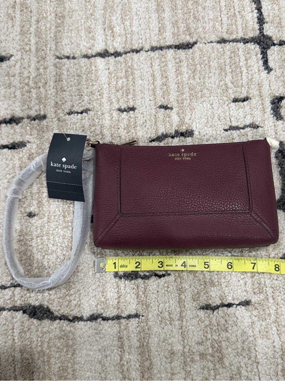 kate spade New York Burgundy Pebbled Leather Wristlet